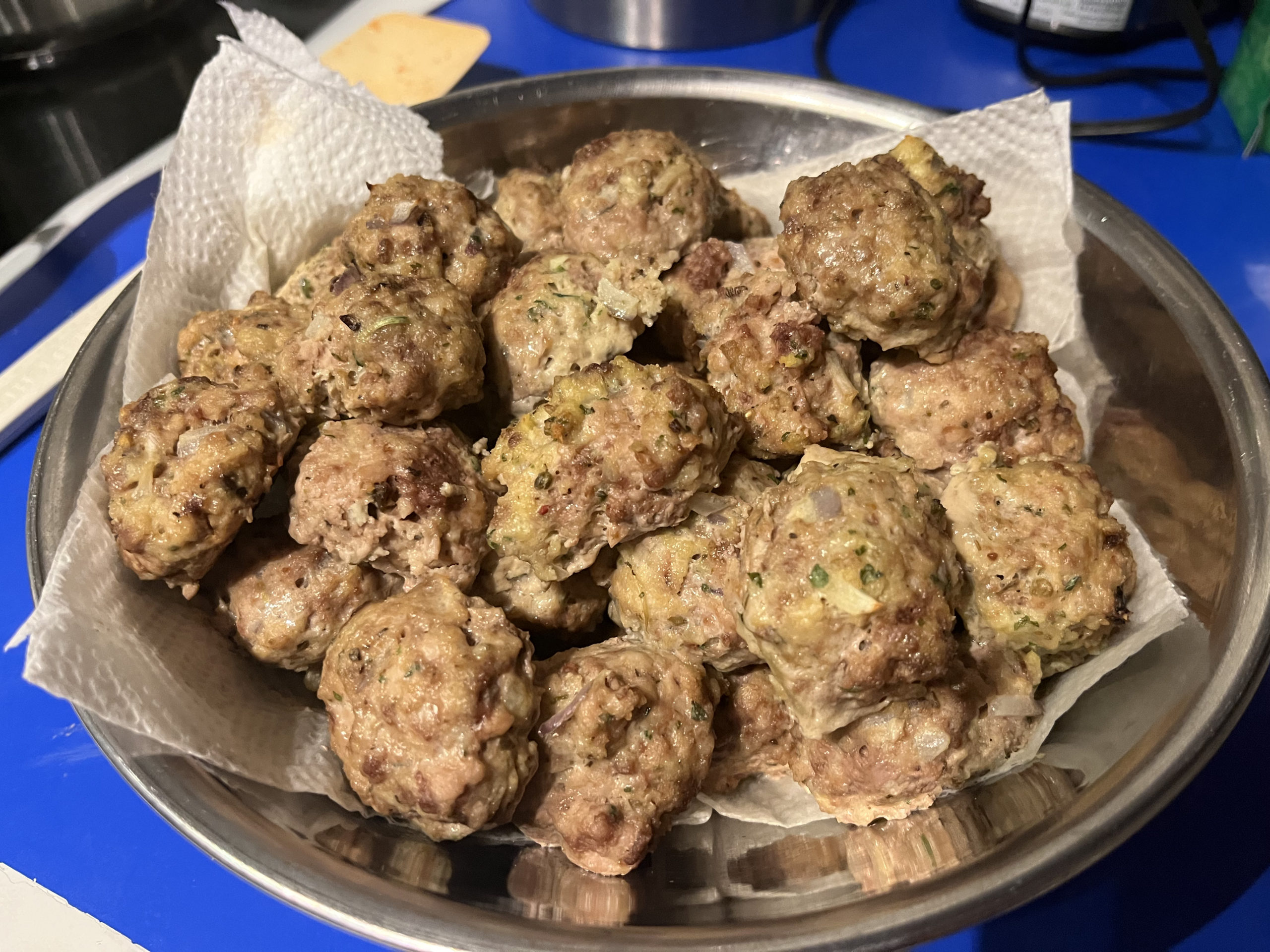 a bowl full of melt in your mouth meatballs